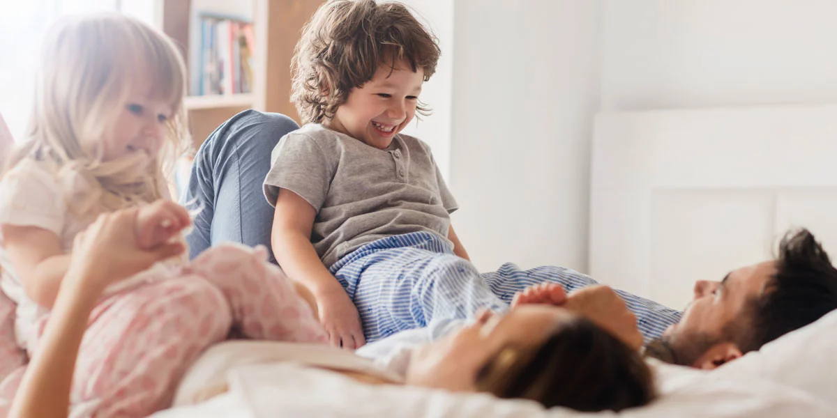 Happy family laughing and playing